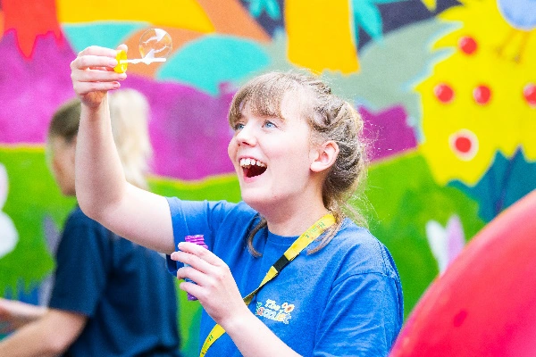 Staff member blowing bubbles